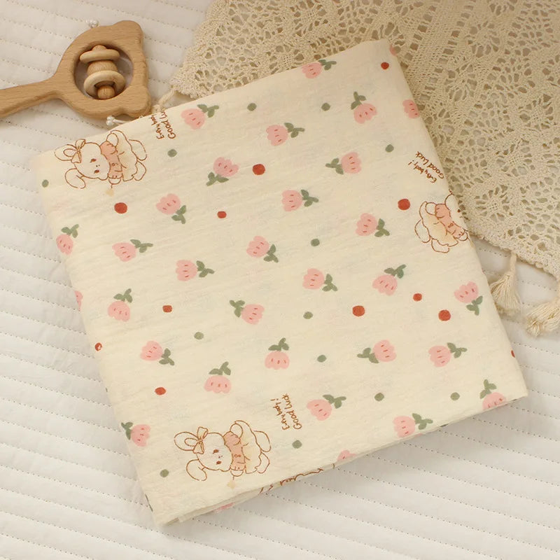Soft cotton muslin baby swaddle blanket with cute cartoon print, breathable and gentle for newborns by I YAN.