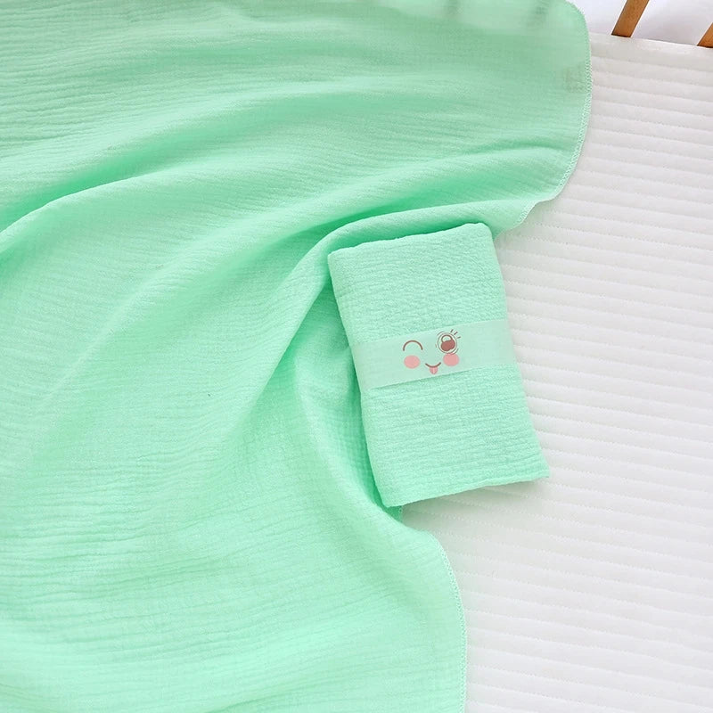 Soft I YAN cotton muslin baby swaddle blanket with cute cartoon print, breathable and gentle for newborns and infants.