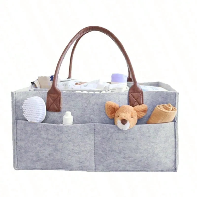 Baby felt nursery organizer basket with handle, large pocket, and storage compartments by I YAN for diapering and nursery organization.