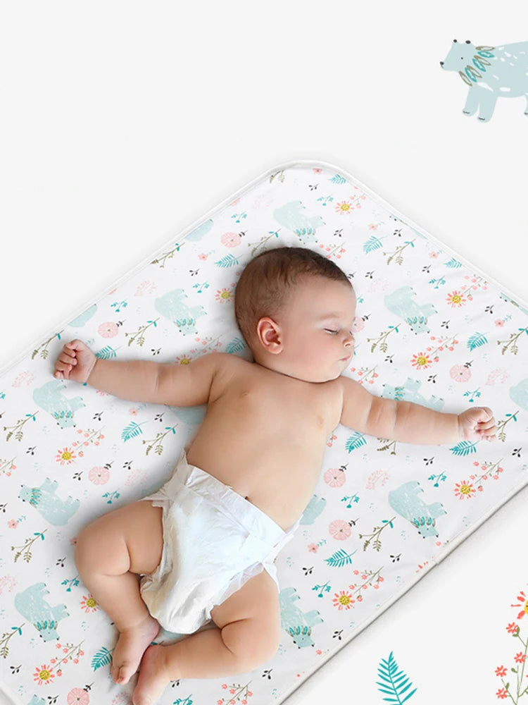 Waterproof baby changing pad cover by I YAN on a soft, reusable diaper mat with secure edges for easy changing.