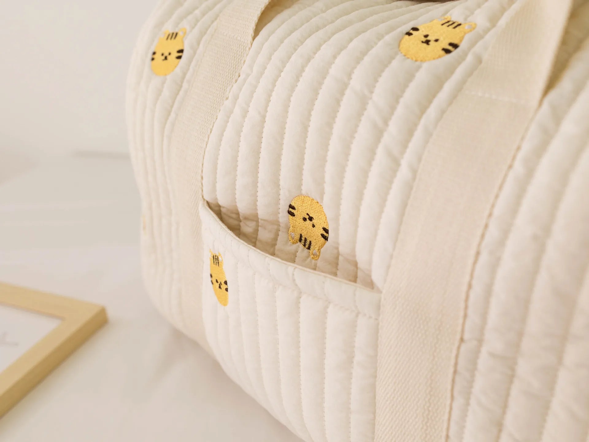 I YAN Mommy Bear Maternity Diaper Bag with stroller straps, multiple compartments, and portable tote design for travel and baby care.