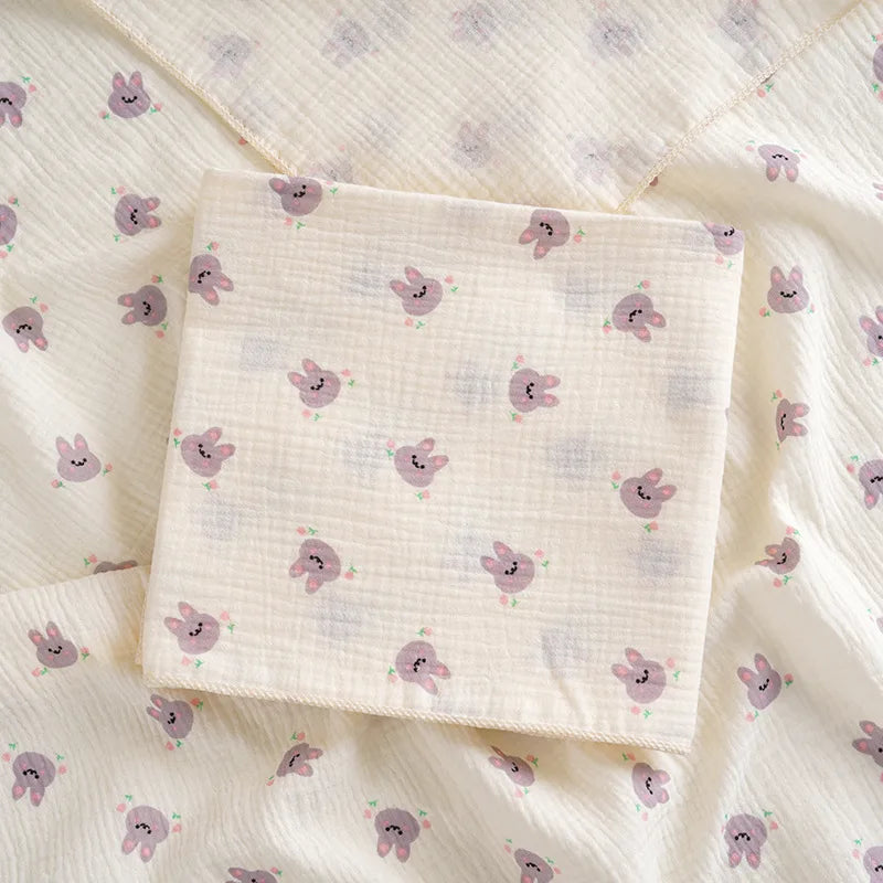 Soft cotton muslin baby swaddle blanket with cartoon prints by I YAN, breathable and gentle for newborns and infants.