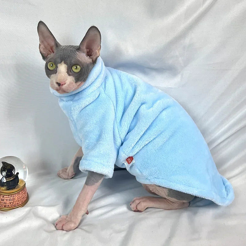 Orange Sphynx cat wearing I YAN knitted sweater, stylish pet jumpsuit for Sphinx cats and kittens, cozy and fashionable pet clothing.