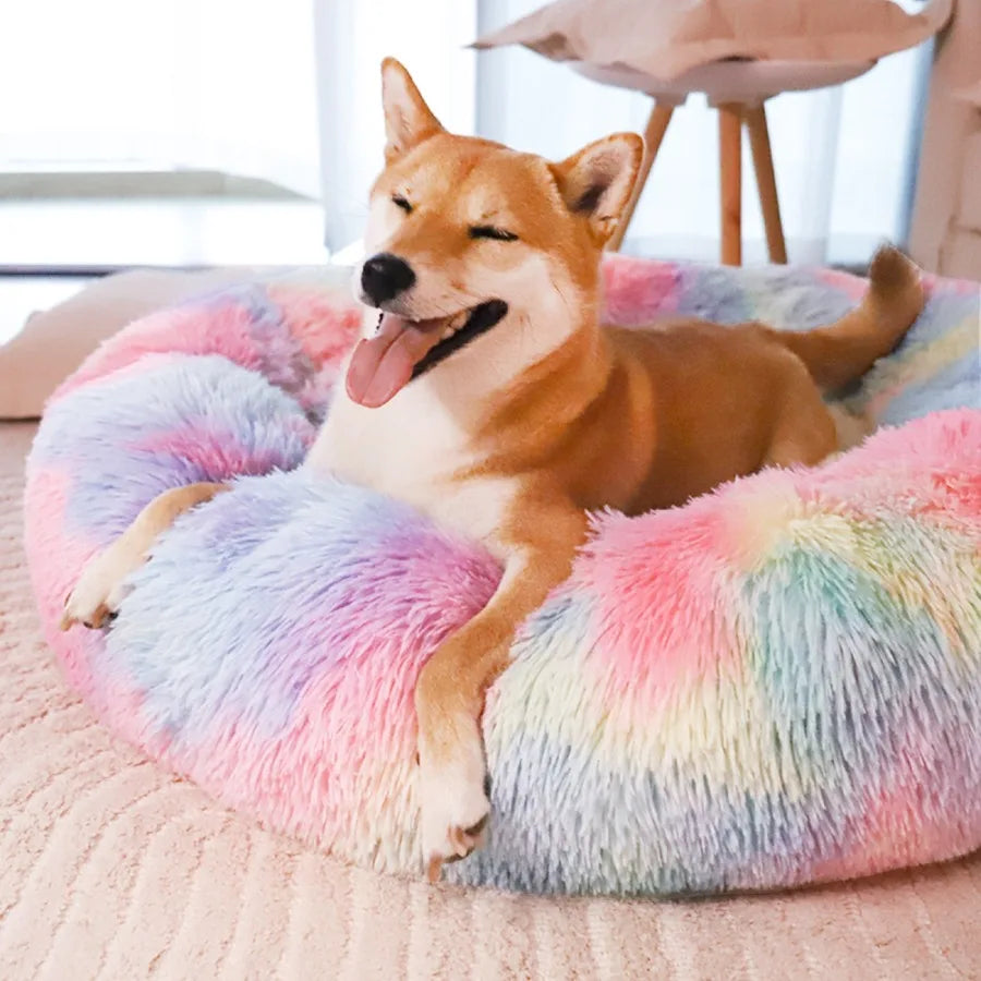 Pink rainbow Calming Donut Pet Bed by I YAN for small dogs, plush, cozy, anti-anxiety dog bed with warming and soft cushioning.