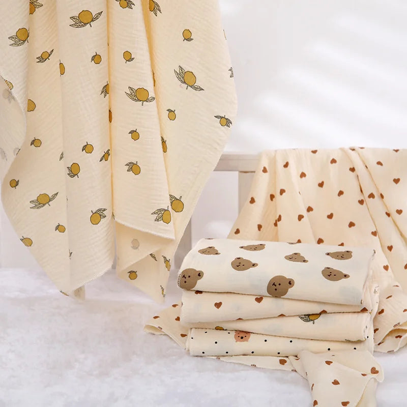 I YAN cotton muslin baby swaddle blanket with cute cartoon print, soft, breathable, ideal for newborn boys and girls.