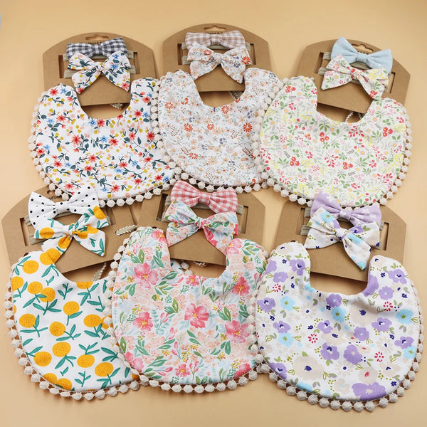 Set of three flower print cotton linen baby bibs, elastic nylon headbands, and double-deck saliva towels from I YAN.
