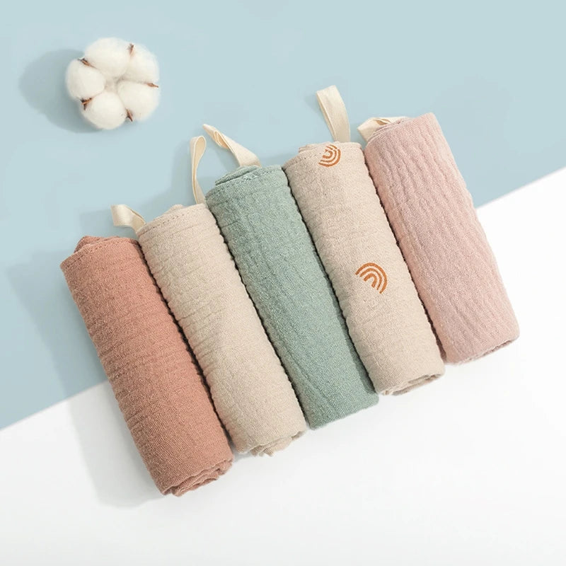 Set of five I YAN square cotton baby face towels and burp cloths with soft absorbent gauze for infants and kids.
