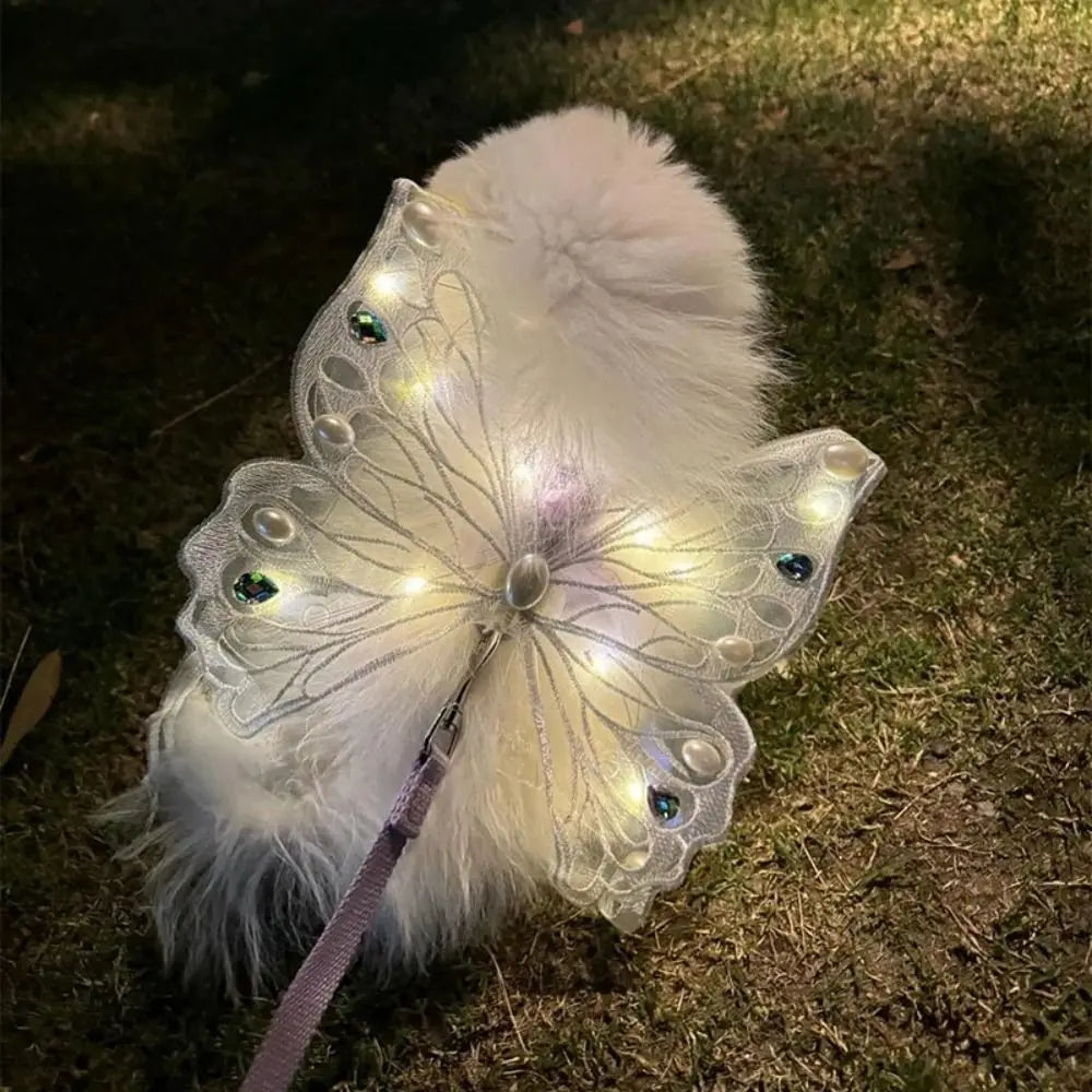 Dog and cat wearing I YAN butterfly wings pet costume with colorful, decorative butterfly wing back accessory.