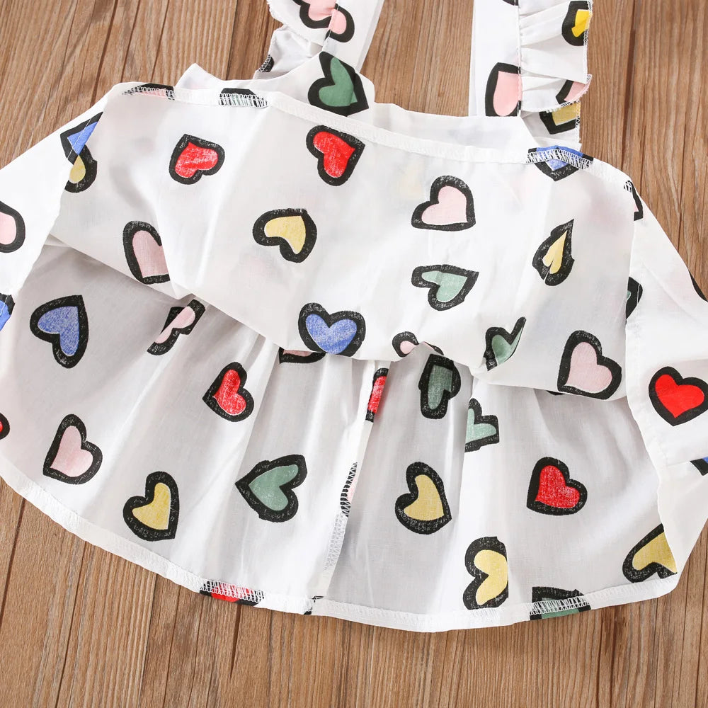 Colorful baby girl summer dress by I YAN with playful dragonfly details, perfect for ages 0-3, shown with a cute crossbody bag.